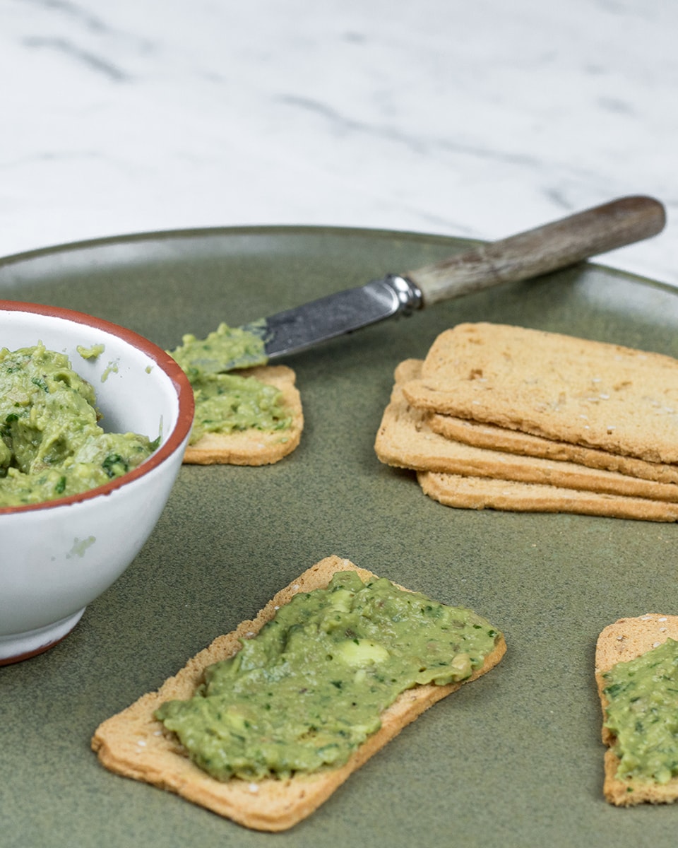 Basil pesto with avocado, garlic, olives and nutritional yeast