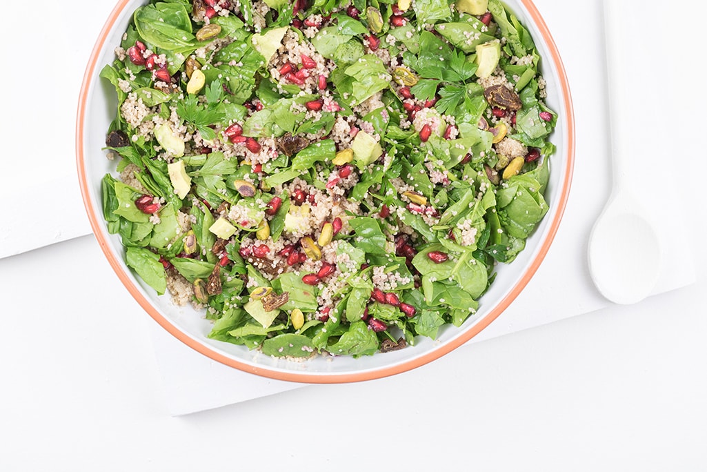 Moroccan couscous salad with dates and pistachios photographed from above