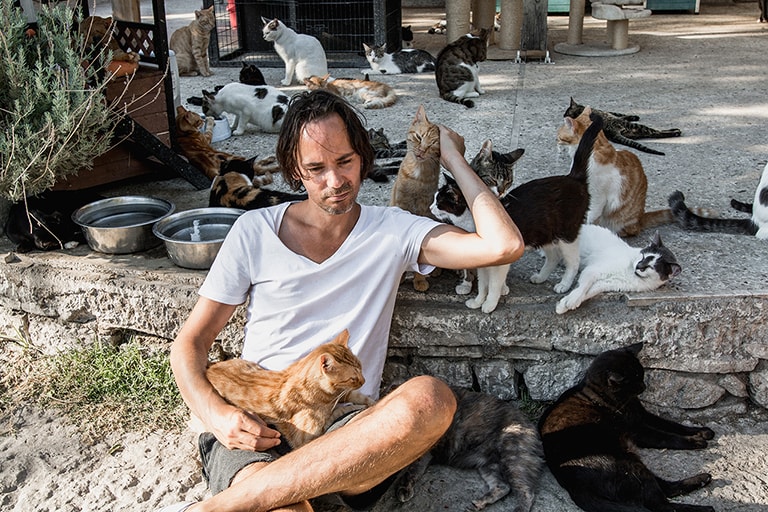 Hugging cats at Samos Cat Rescue, Samos, Greece