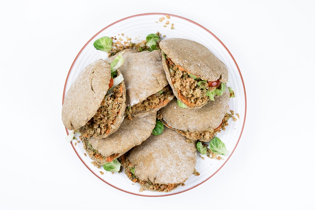Stuffed pitas with Brussels sprouts photographed from above