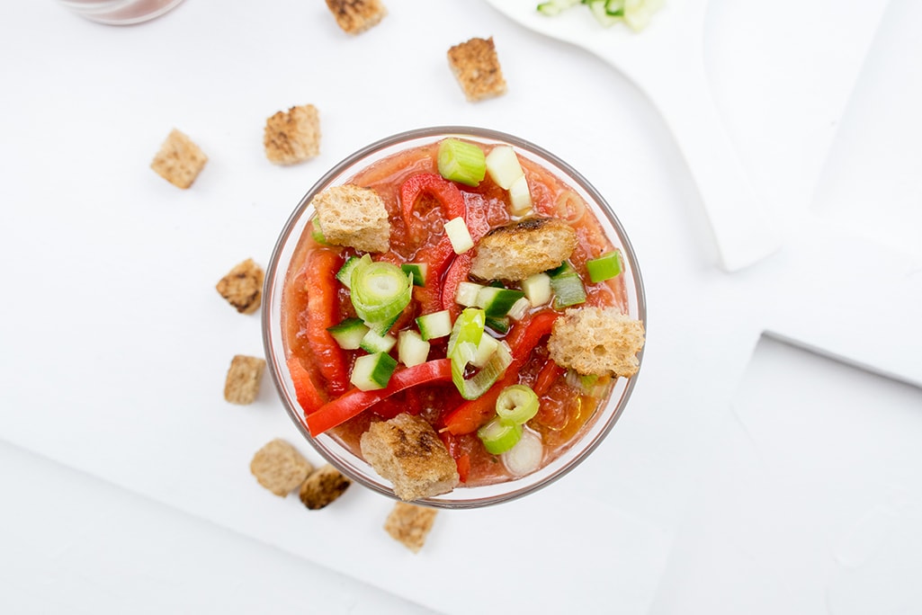 Tomato Gazpacho with croutons photographed from above