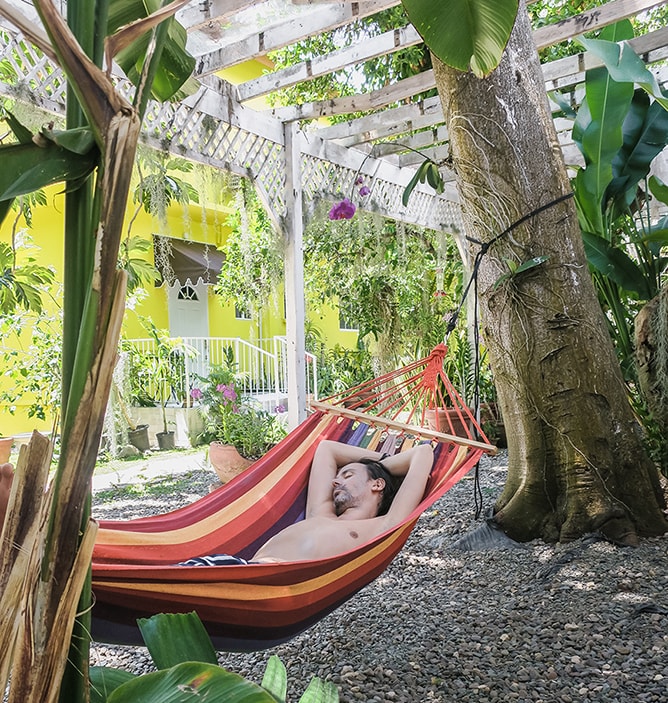 Relaxing in hammock while backpacking Jamaica