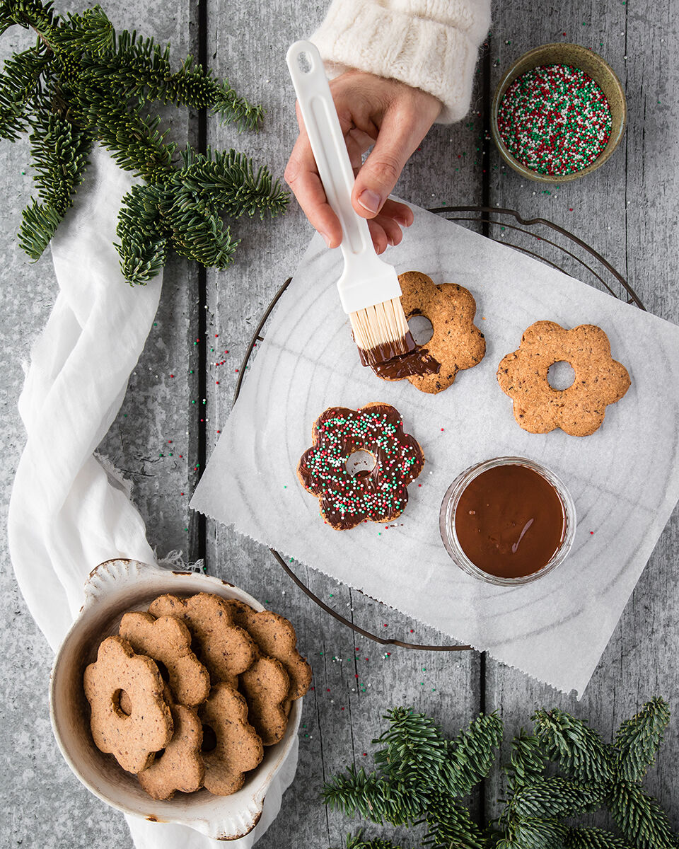 Vegan cut out christmas cookies with dates and chocolate