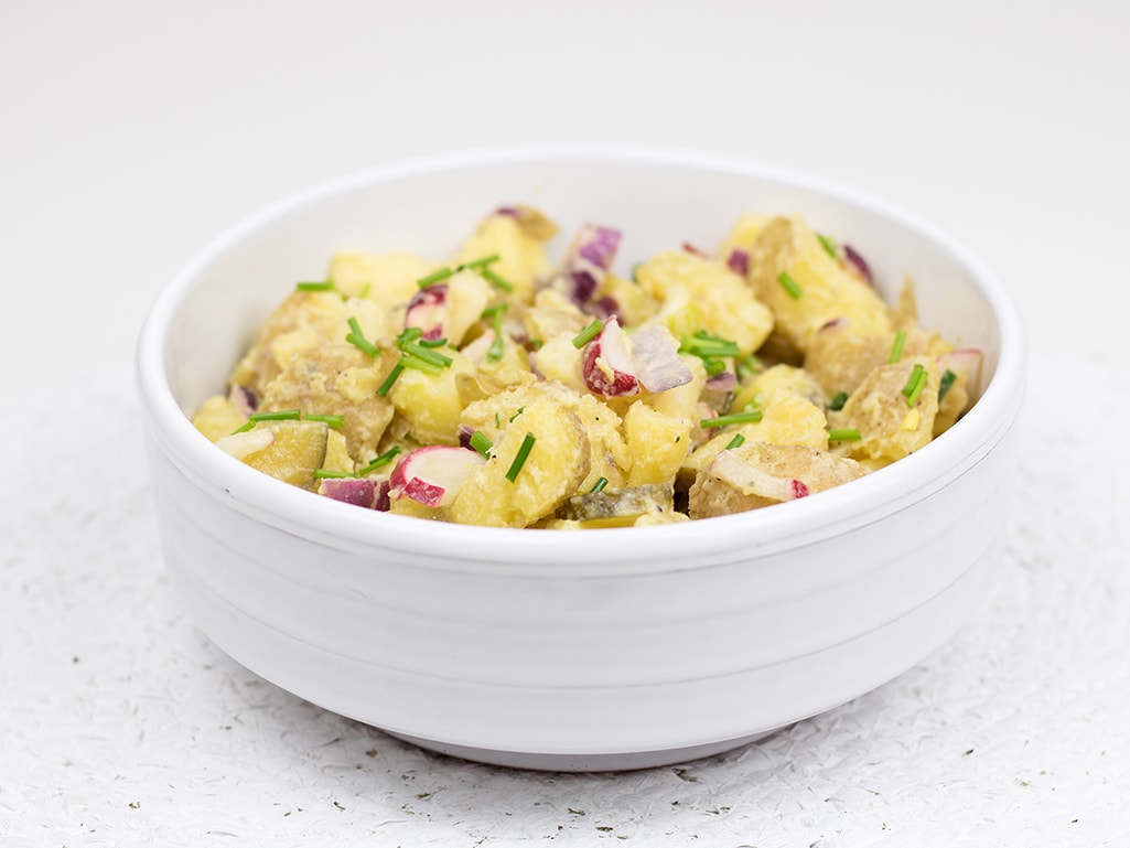 Vegetarian potato salad with apple and radish