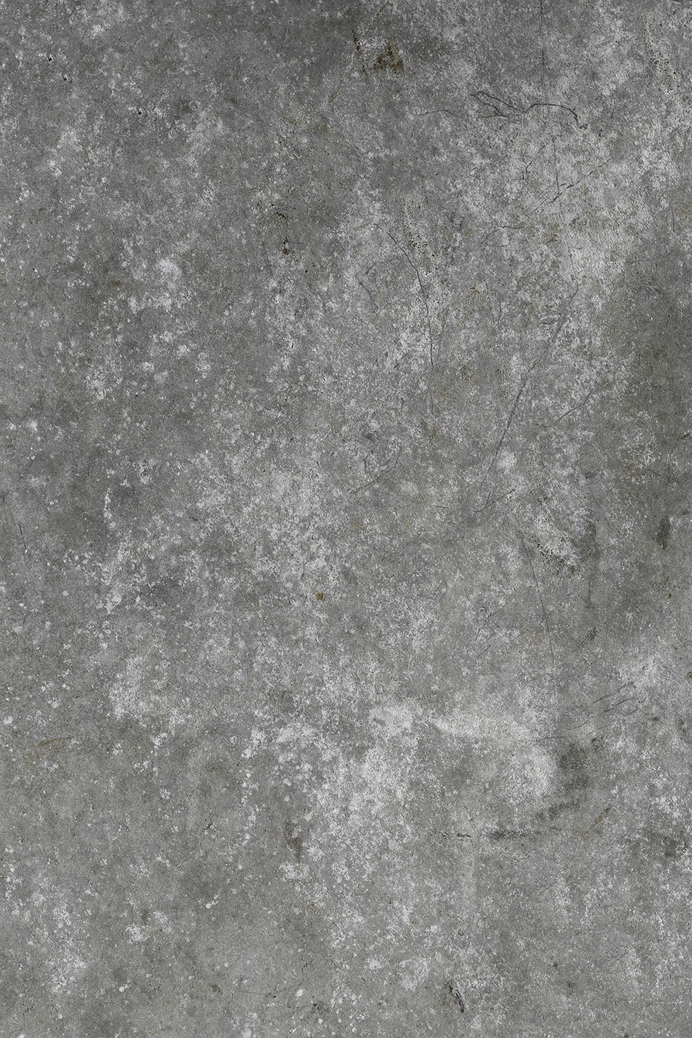Cluttered cement vinyl backdrop is grey toned and has a lot of texture