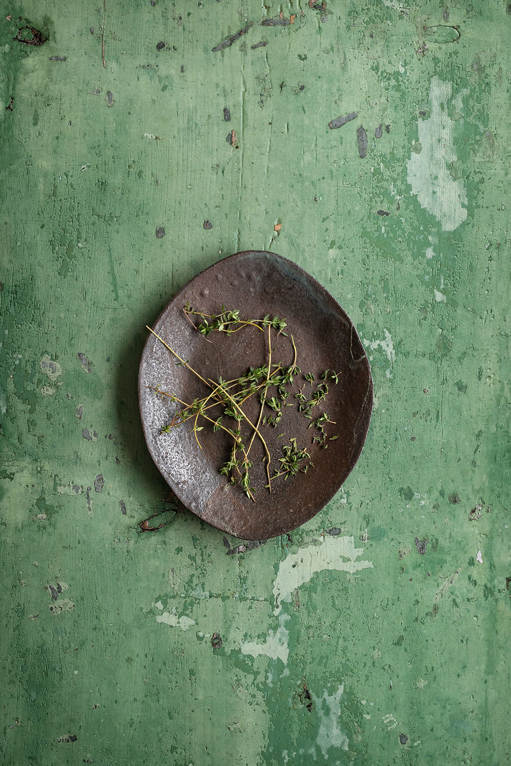 Green weathered wood backdrop with distressed paint