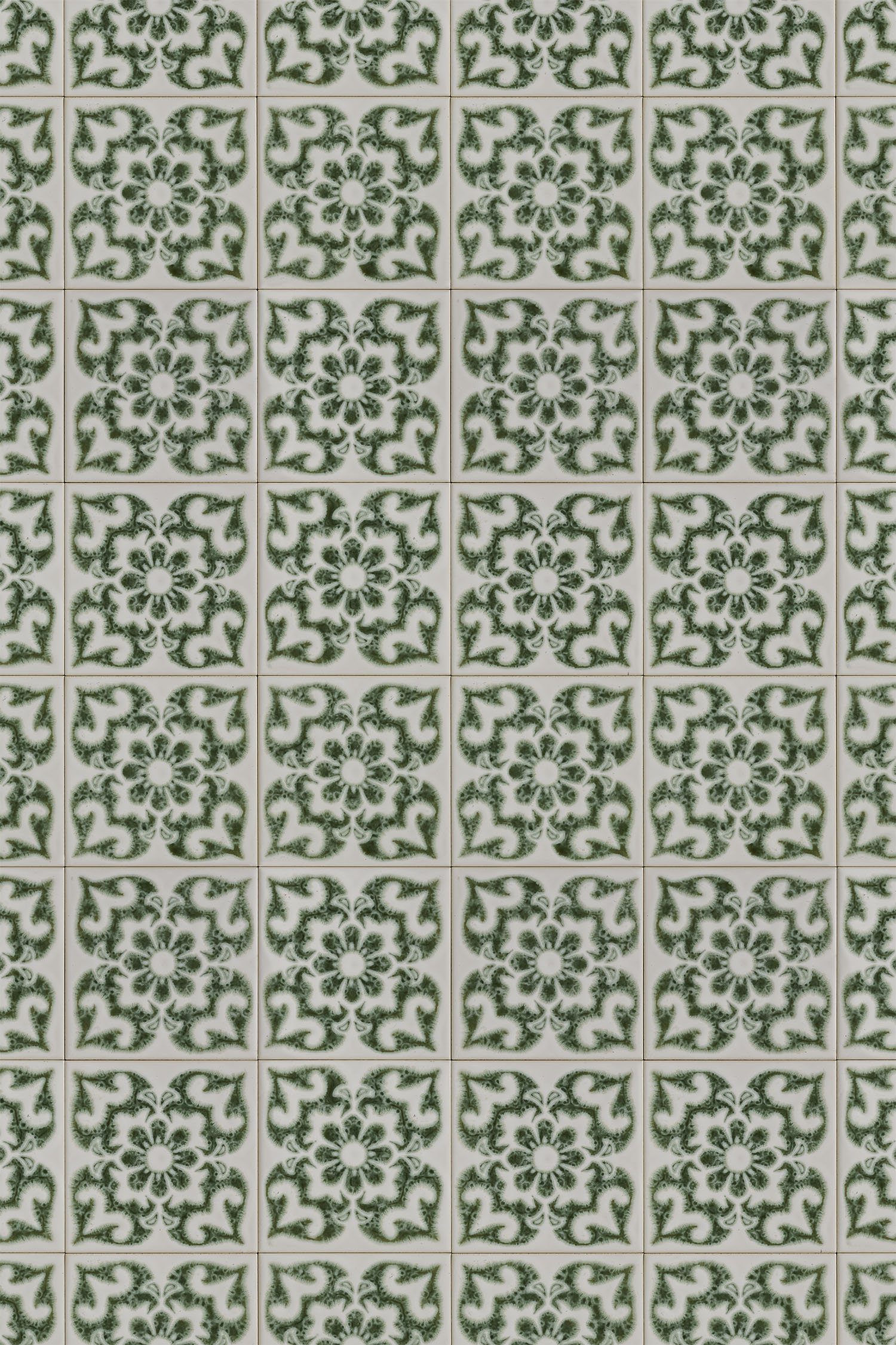 Vinyl background with white tiles and a dark green flower pattern