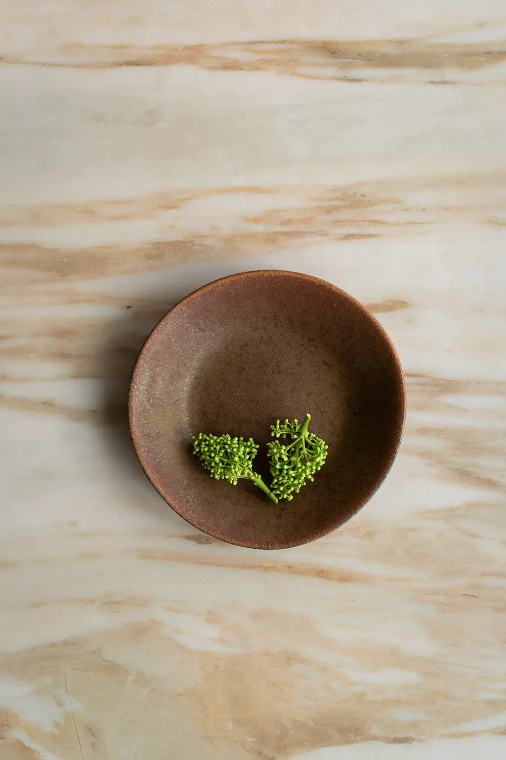 Brown marble photography surface for making storytelling visuals