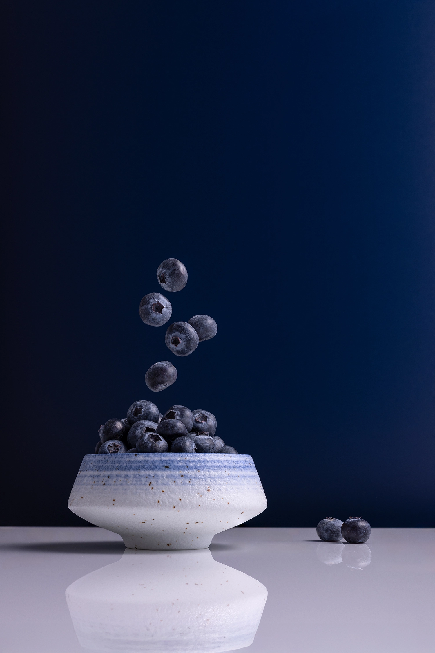 Navy vinyl product photography backdrop with matte finish