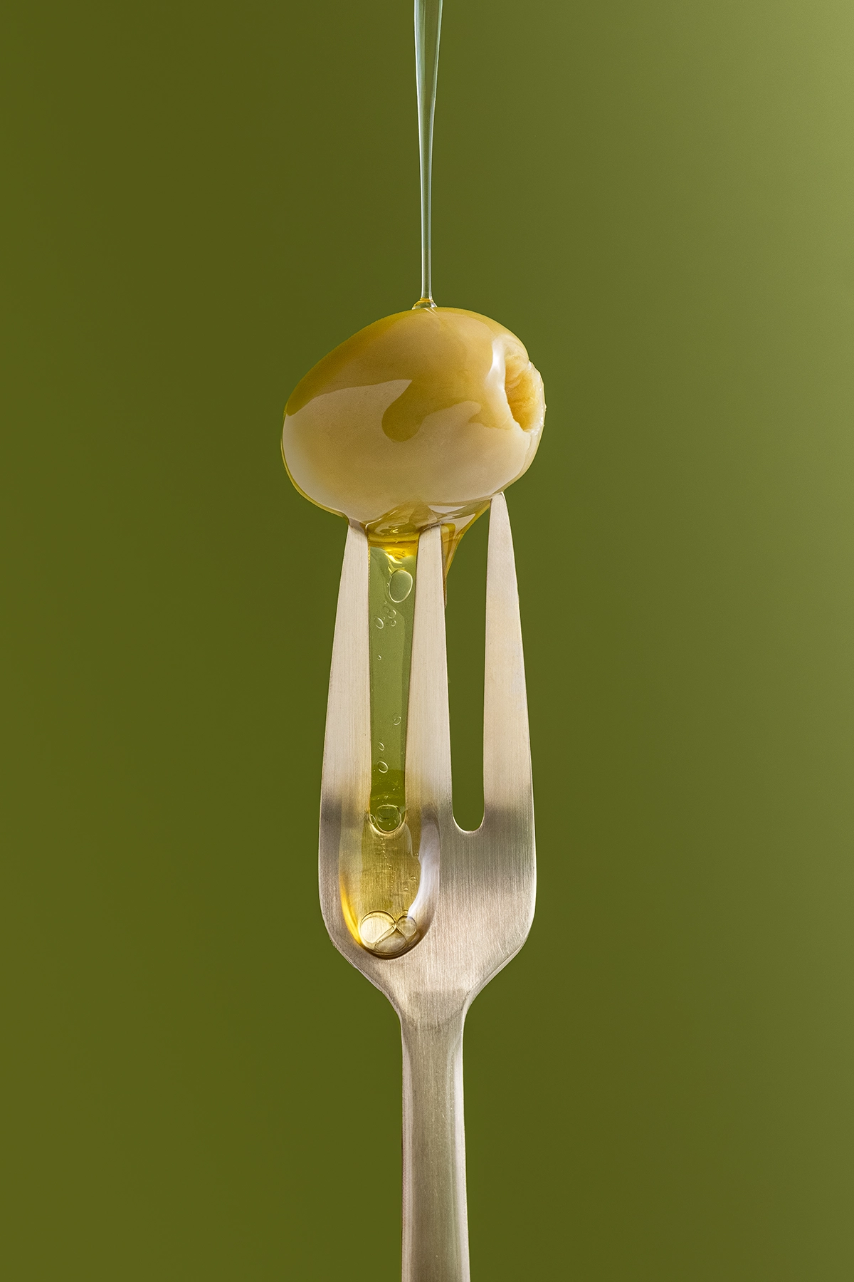 Solid olive color surface for flat lay styling and product photography