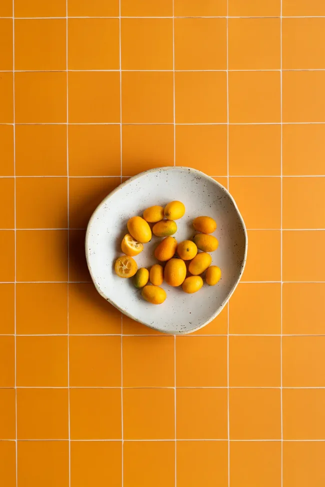 Vivid orange tile backdrop for brand shoots and food photography