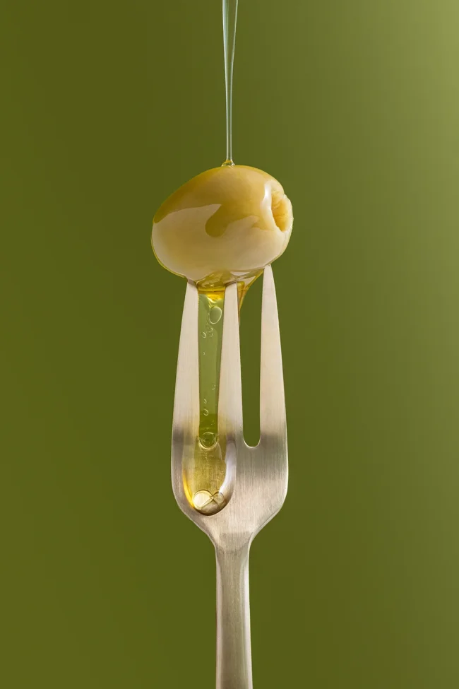 Solid olive color surface for flat lay styling and product photography