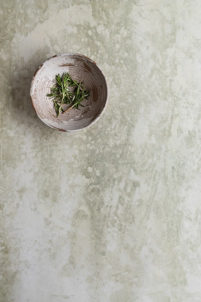 Vinyl backdrop rosemary has a soft texture & warm green grey tone